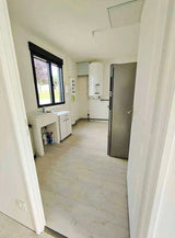 CONTENEDOR HABITABLE TERMINADO EN MADERA